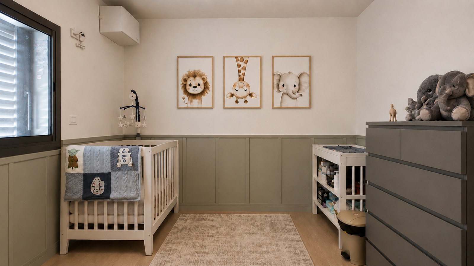 Nursery with sage green panelling, animal prints and a white crib